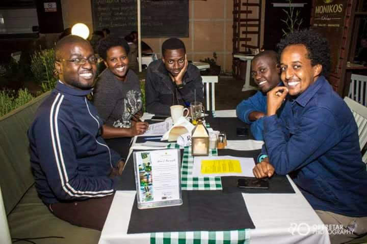 A team gathered around a table on a quiz night