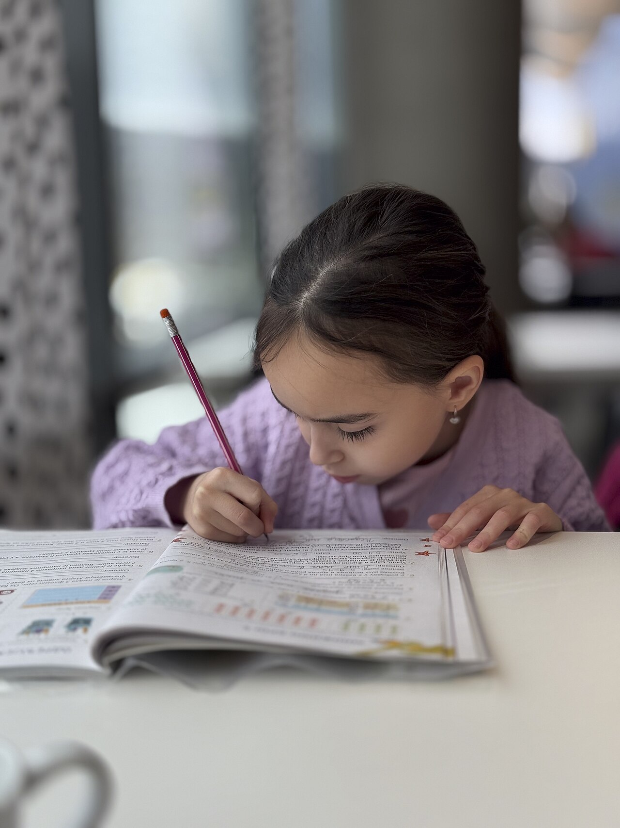 A child writing in a notebook